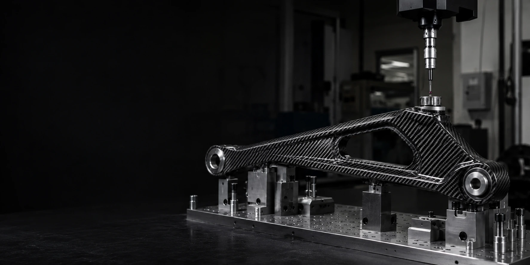 Engineered custom carbon fiber component with integrated metal interfaces