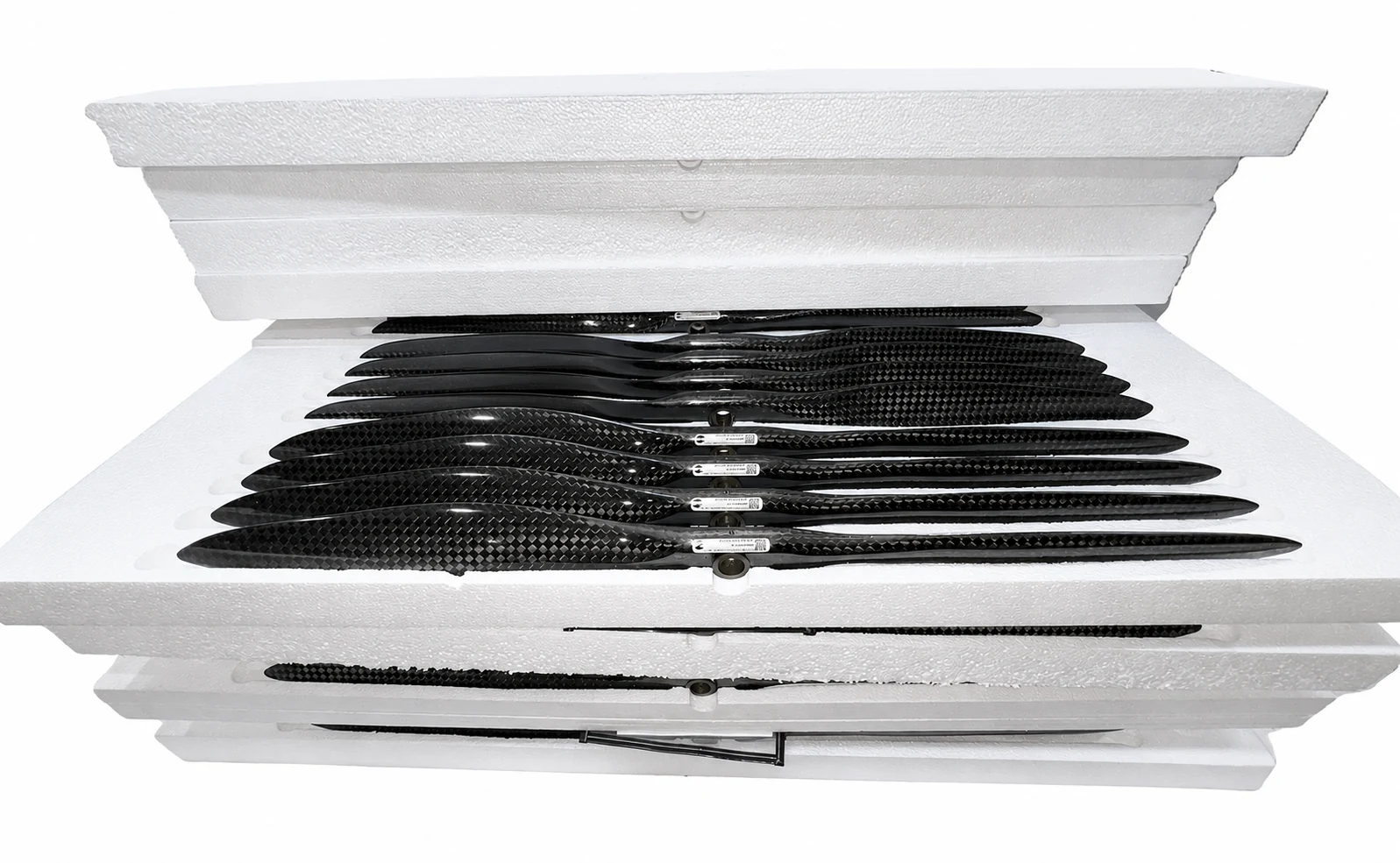 Carbon fiber components separated in protective foam packaging