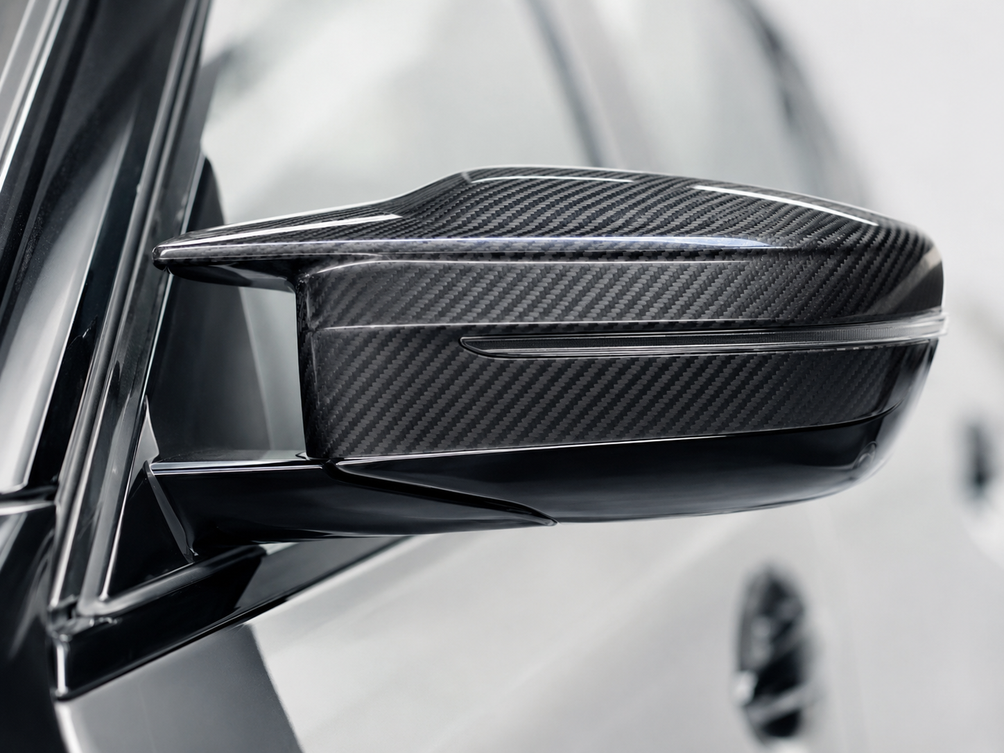 Finished carbon fiber component used to define visible surface zones