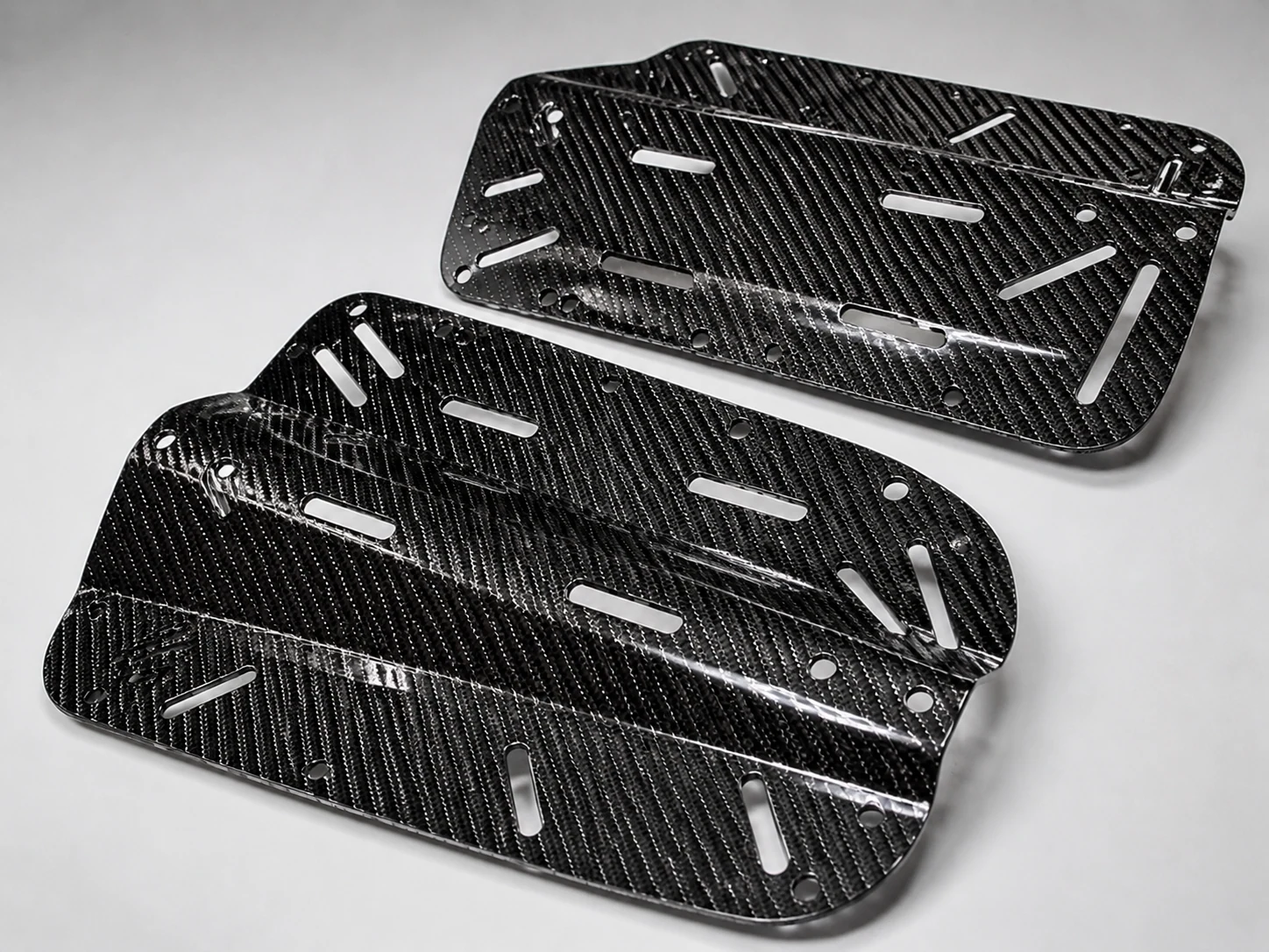Automotive carbon fiber components showing installation and fit geometry