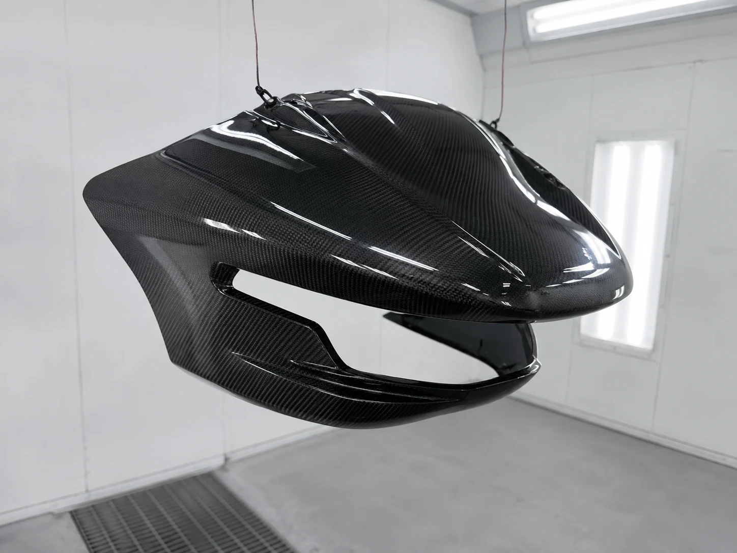 Contoured carbon fiber cover showing edges and assembly interfaces
