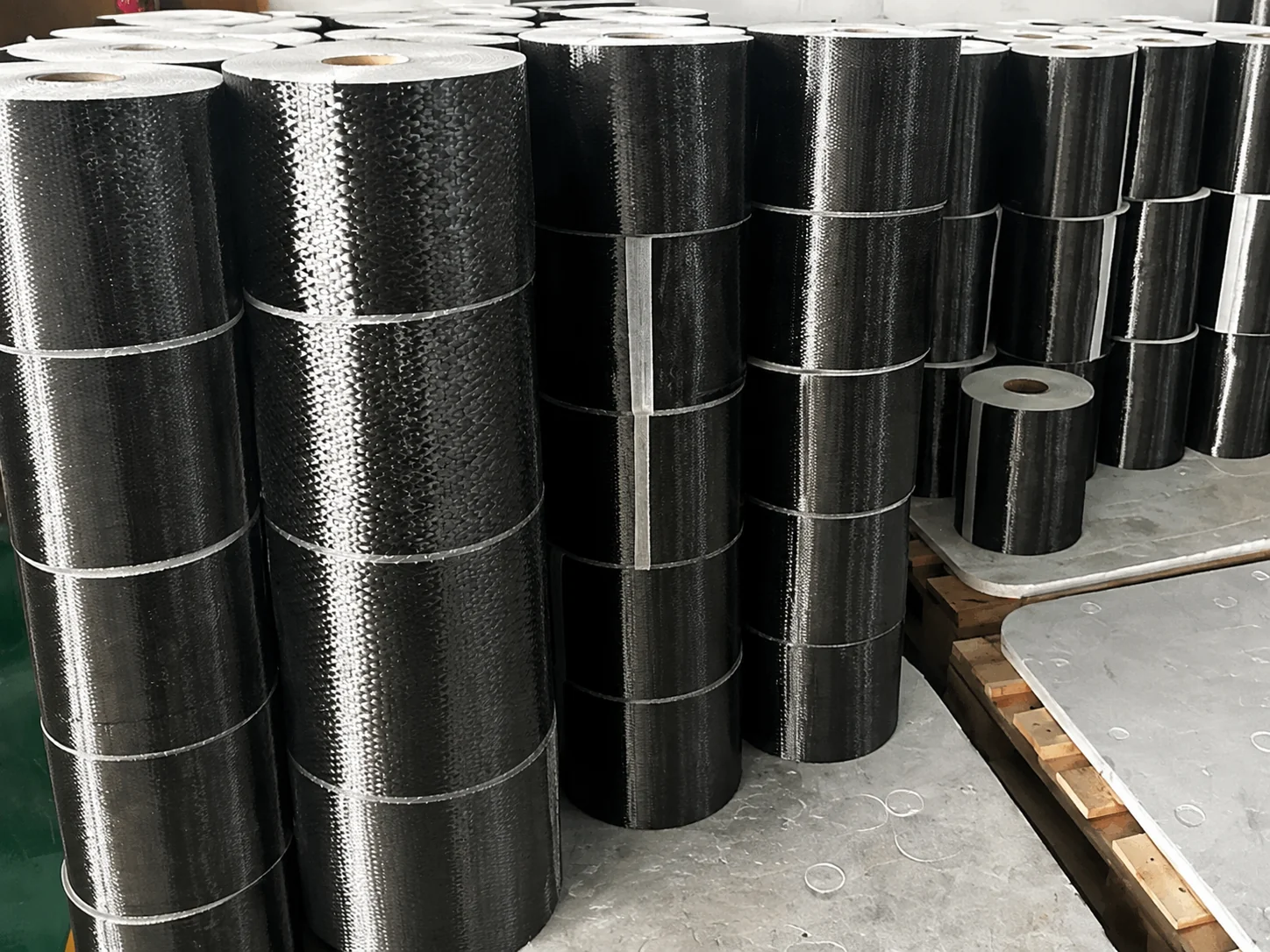 Industrial rolls of dry carbon fiber reinforcement material