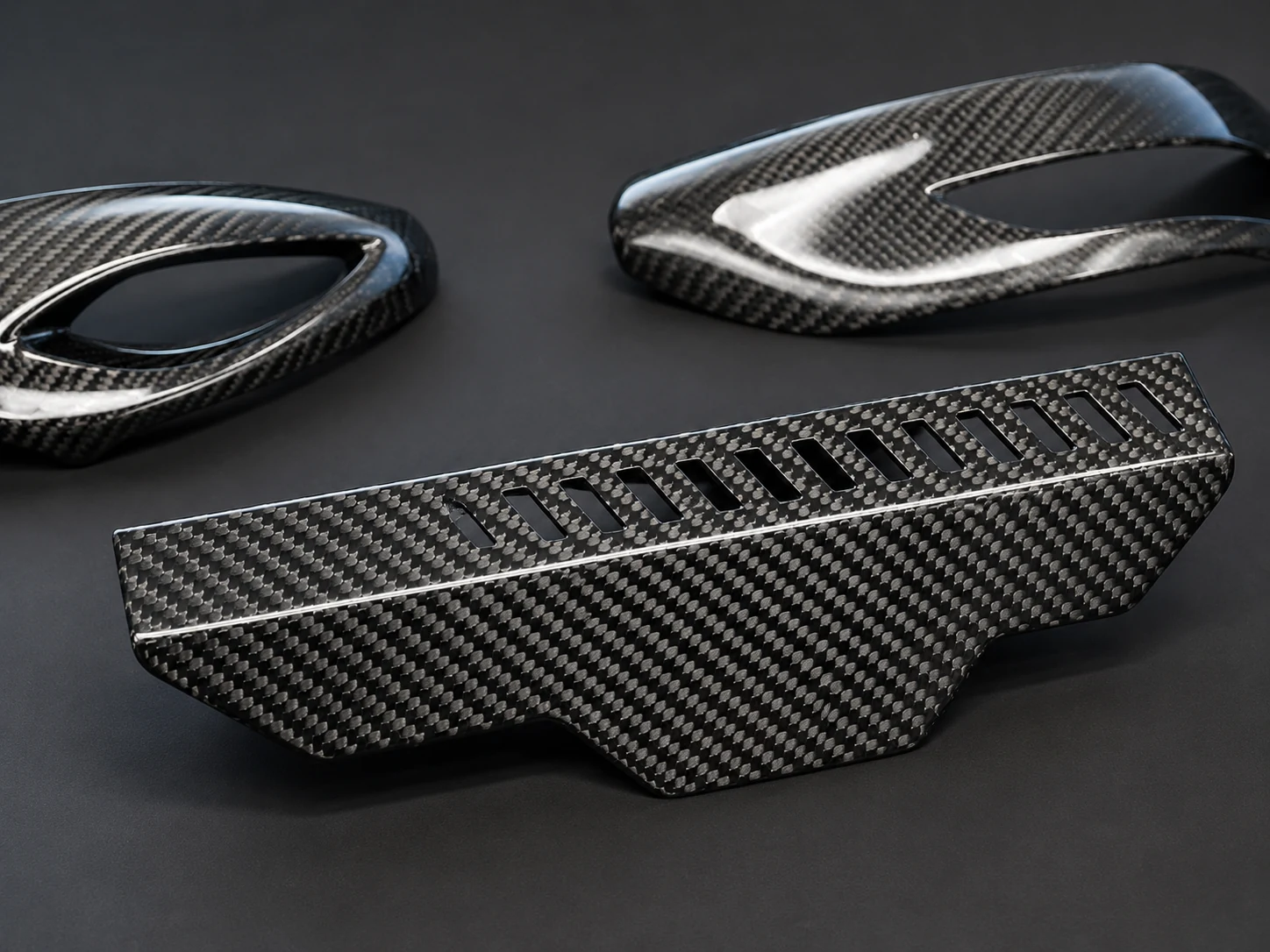 Glossy carbon fiber surface under finished-part inspection