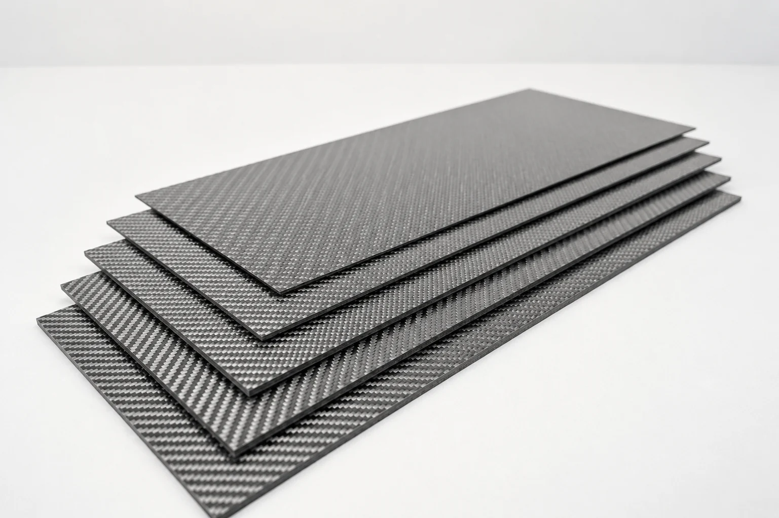 Stacked carbon fiber laminate and sandwich panel constructions