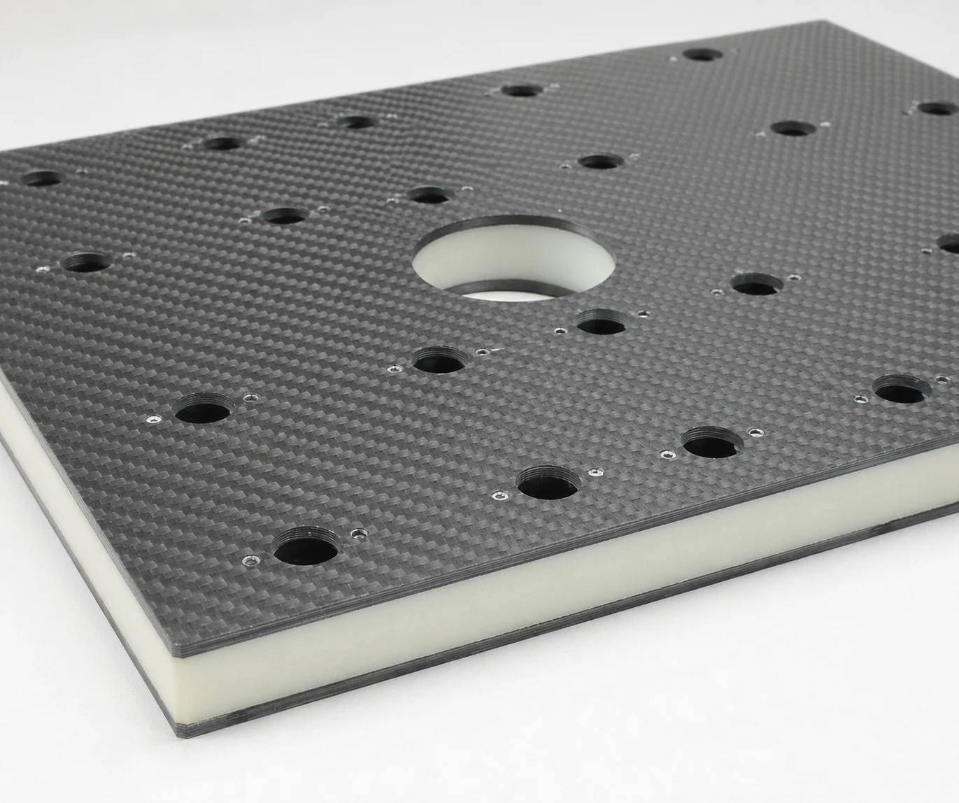Carbon fiber panel cross-section showing skins, core and interface architecture