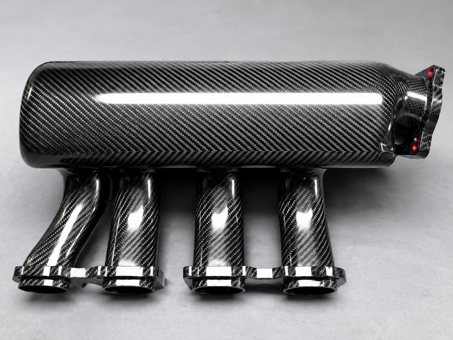 Metal insert integrated into a carbon fiber component