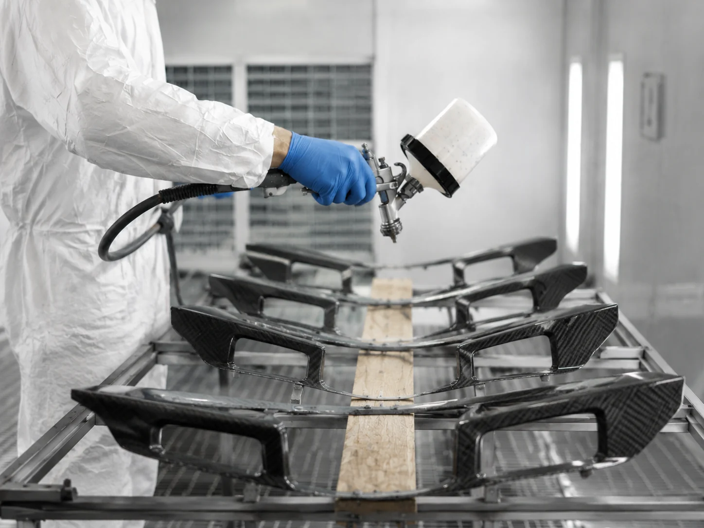 Technician preparing a small batch of carbon fiber parts