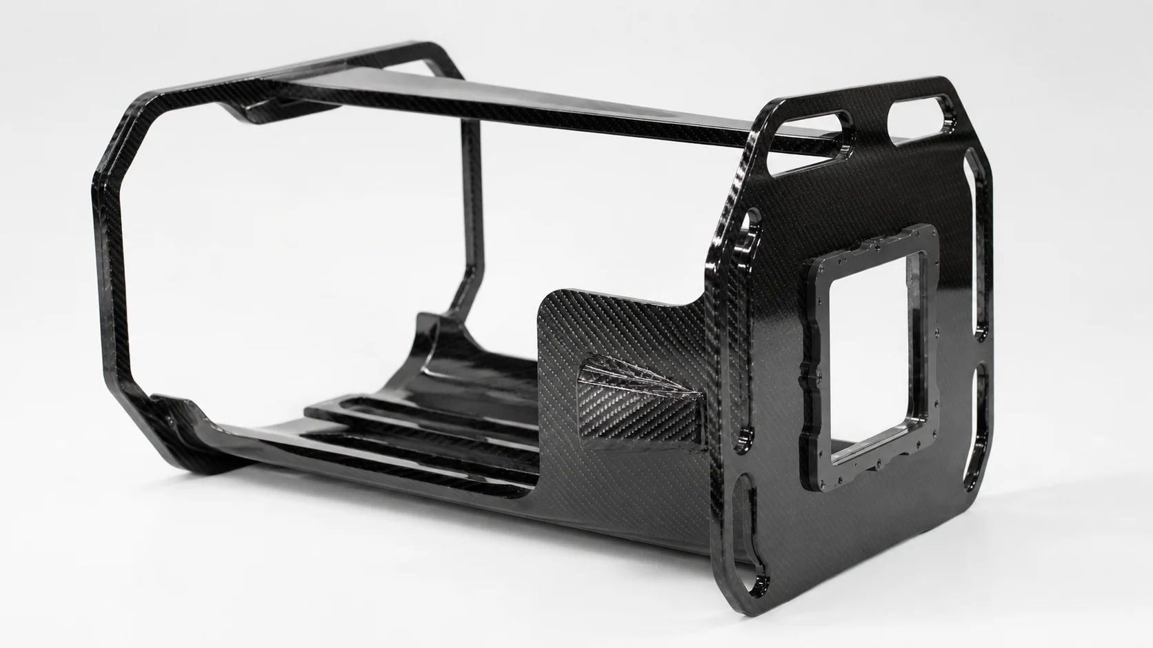 Finished carbon fiber frame showing formed panels, openings and assembly interfaces