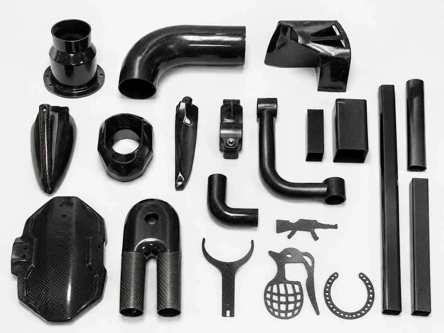 Assorted carbon fiber components representing different project review needs