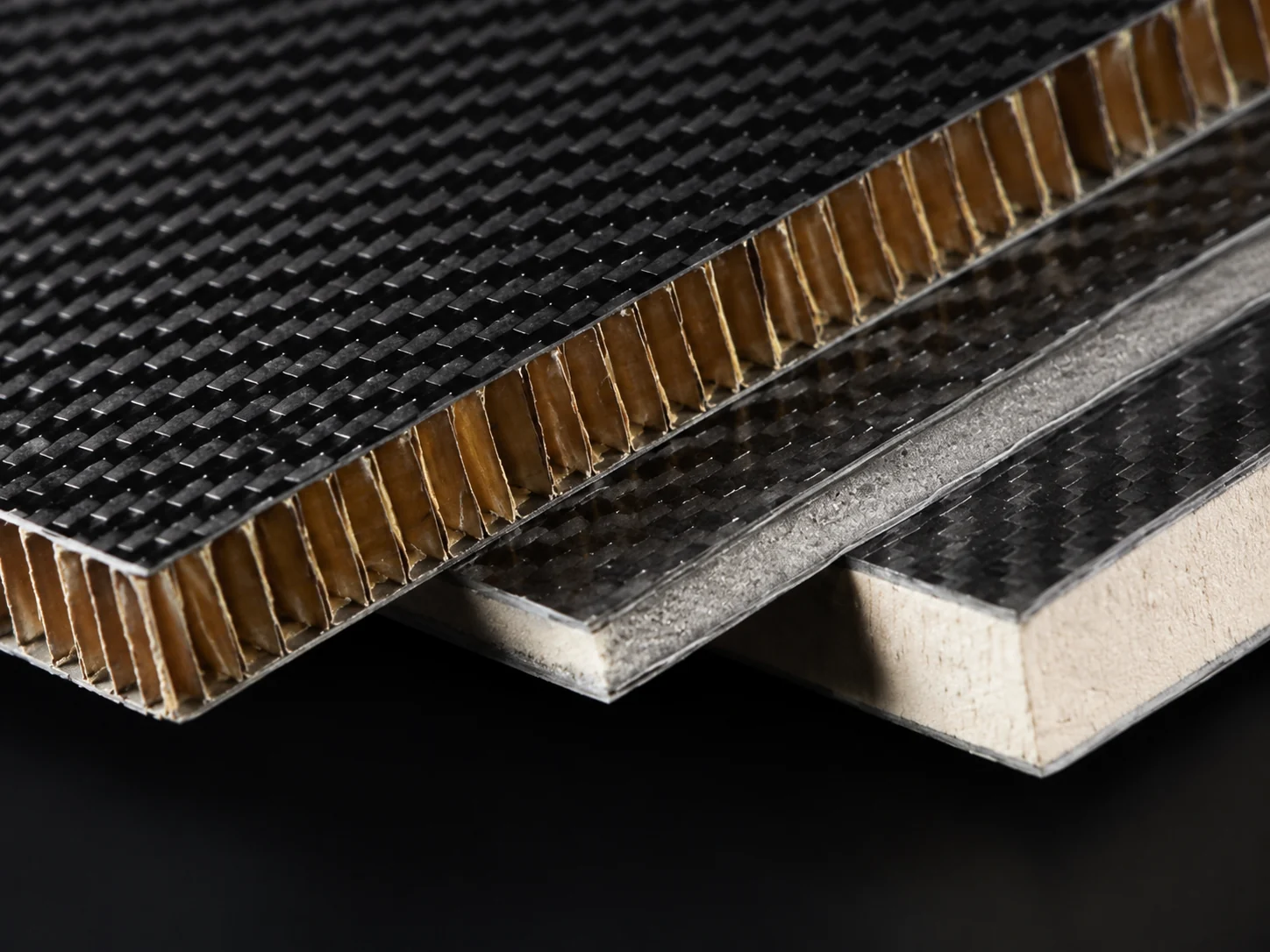 Carbon fiber sandwich panels with honeycomb, foam and solid laminate constructions