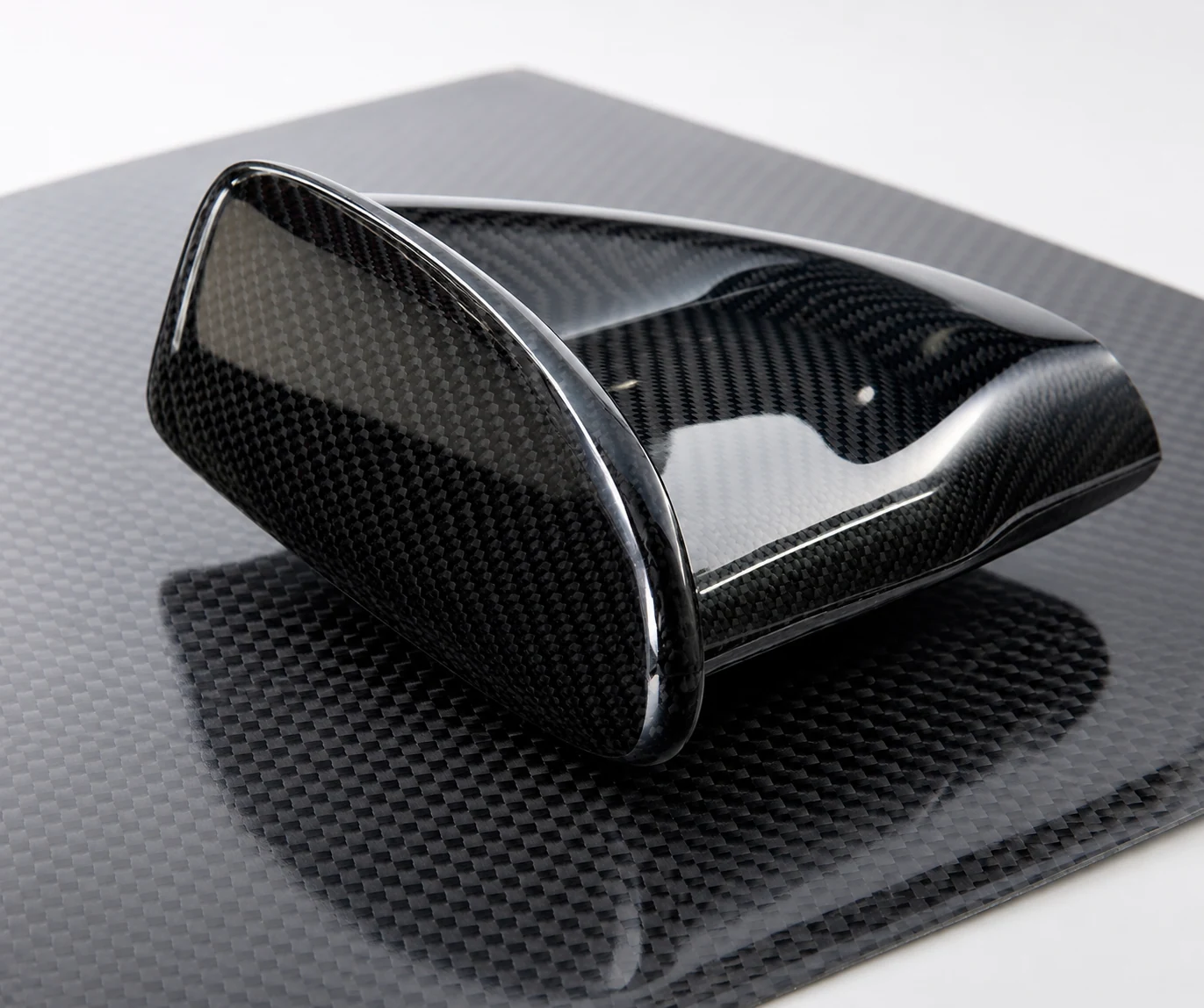 Finished carbon fiber surfaces prepared for brand and appearance requirements