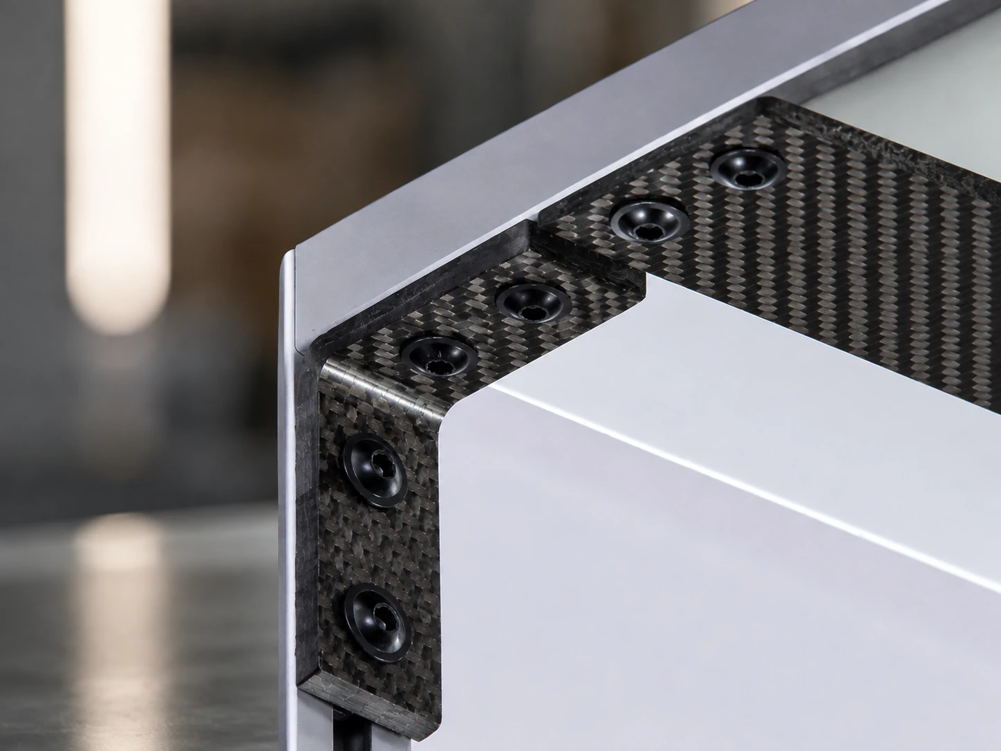 Finished carbon fiber component with included interfaces and hardware