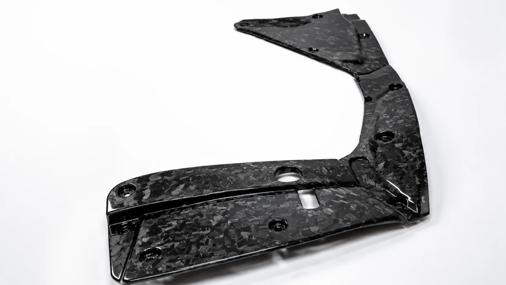 Molded forged carbon component with holes and a glossy chopped-fiber surface