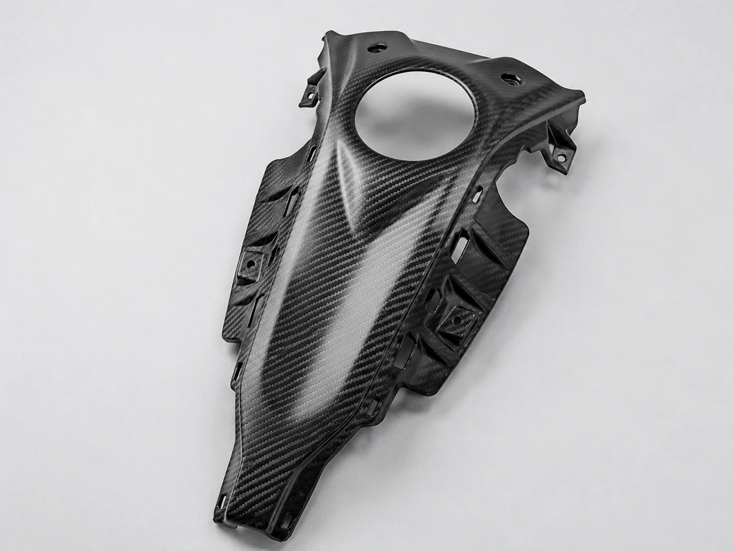 Carbon fiber motorcycle center panel with mounting holes and tabs